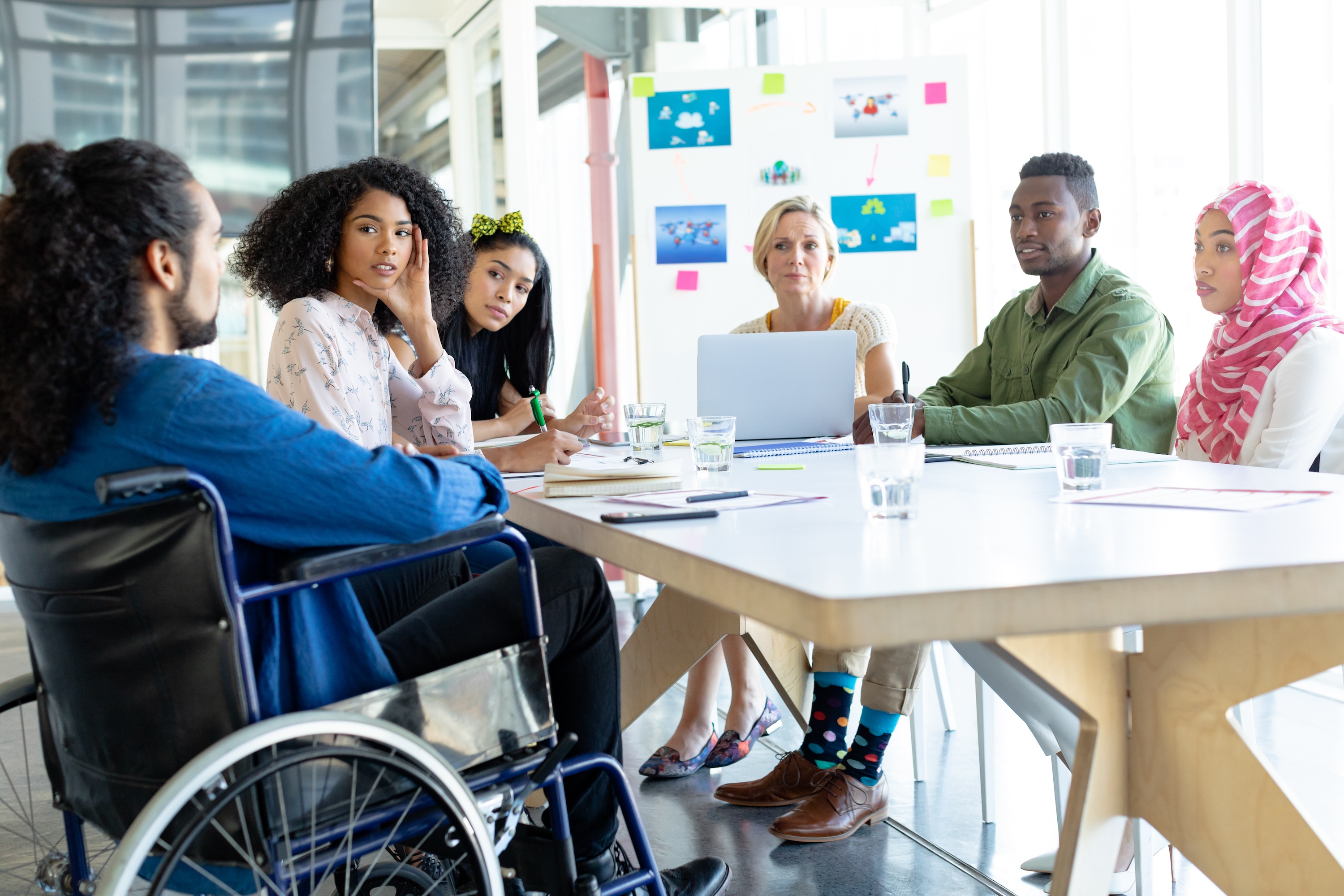 Business people discussing Non-profit profits in meeting