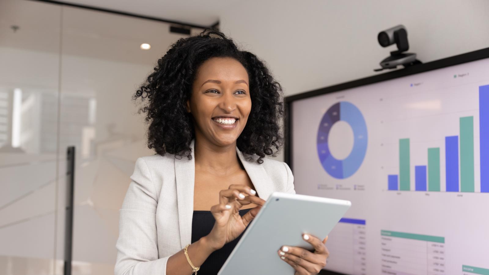 Successfully smiling your business woman using digital tablet